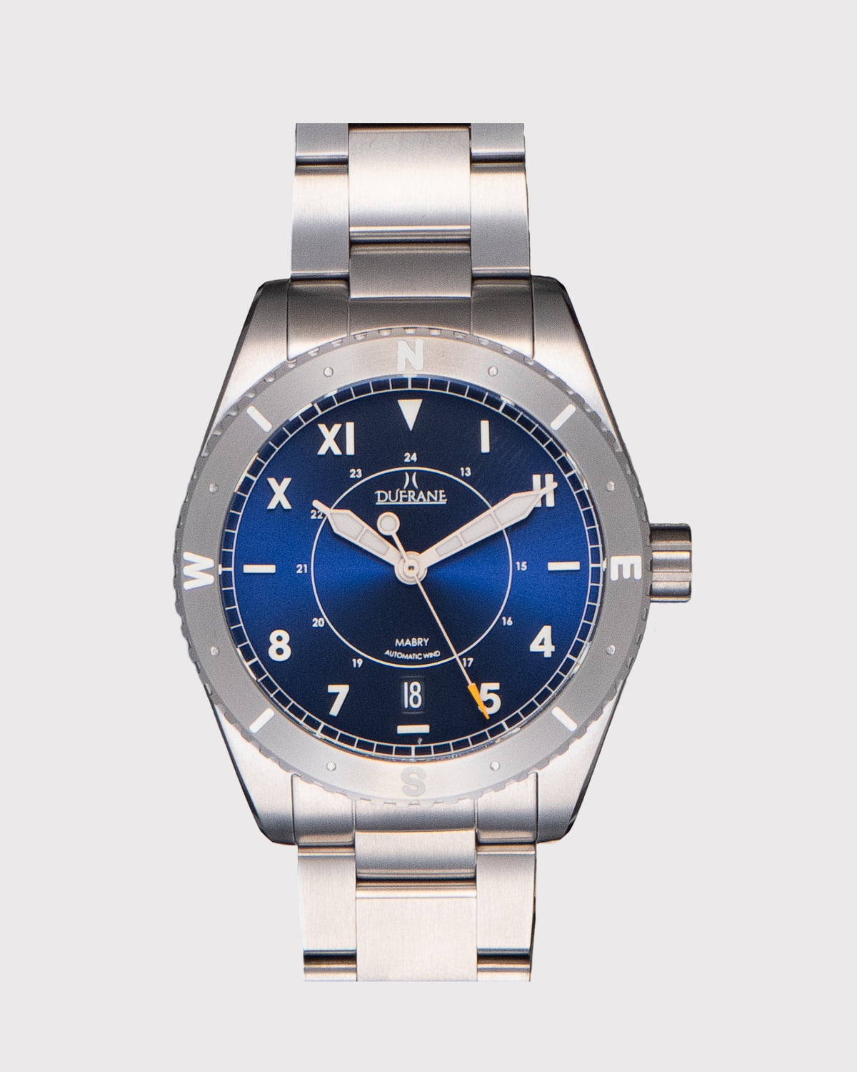 Silver watch with a blue face on a light gray background