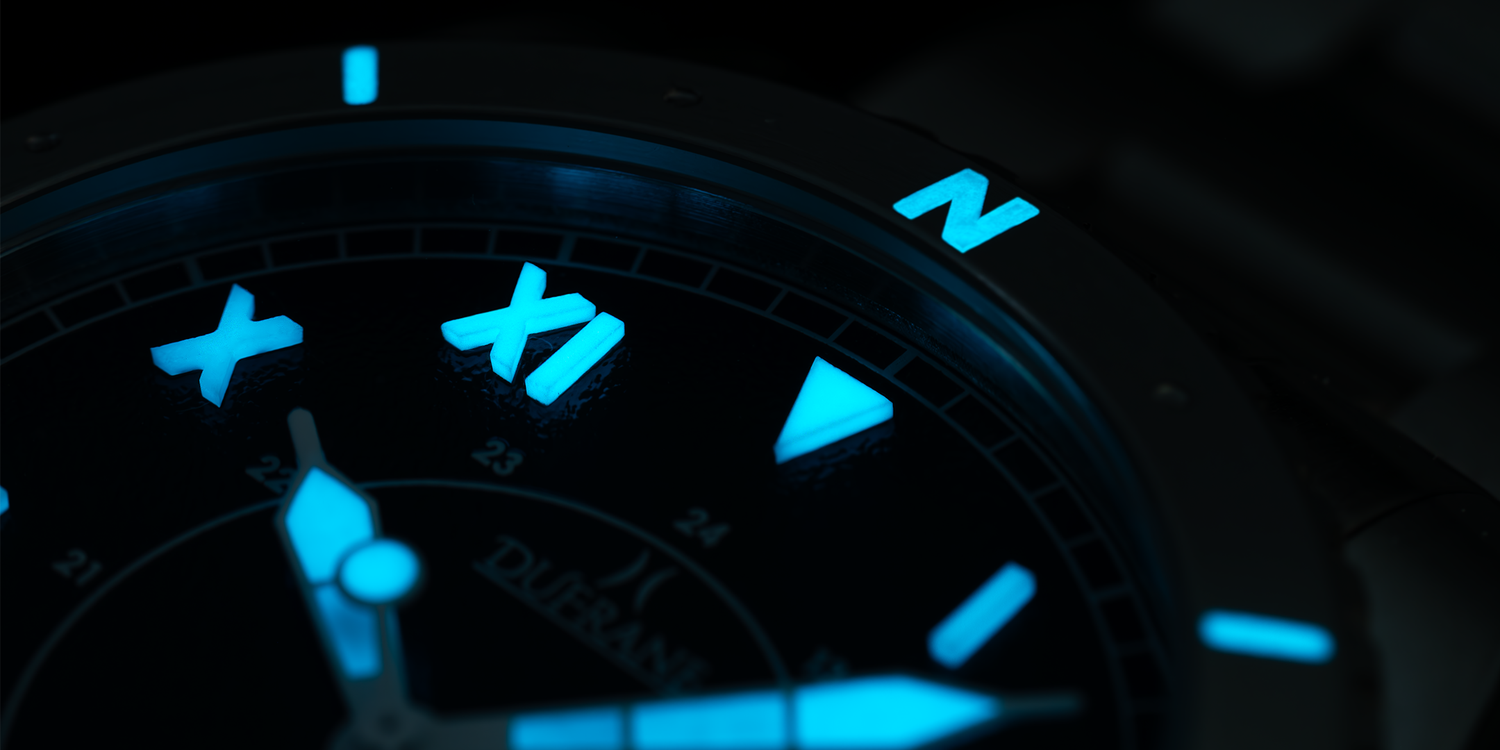 Glowing compass bnezel with blue lights on a dark background